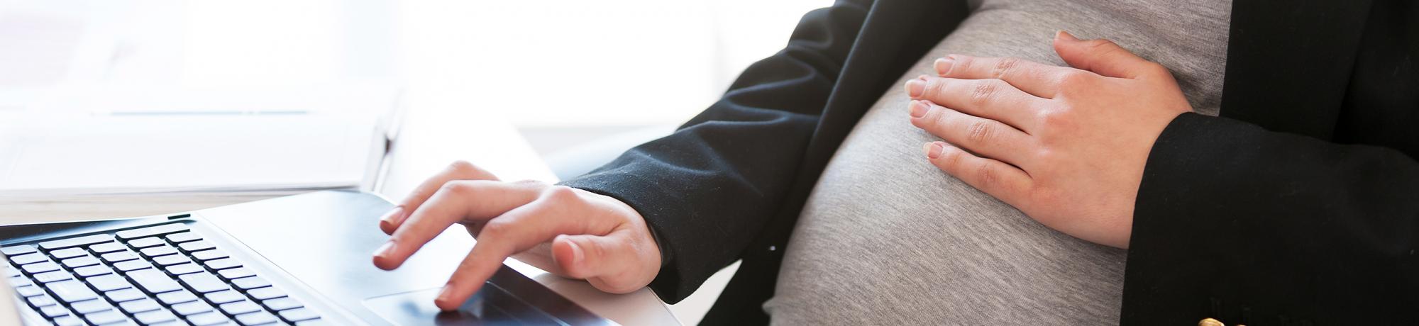 pregnant woman on computer